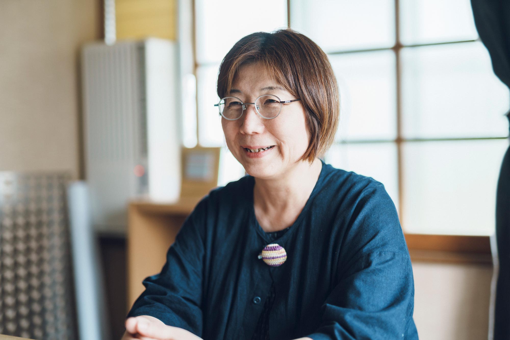 代表取締役の石頭悦氏